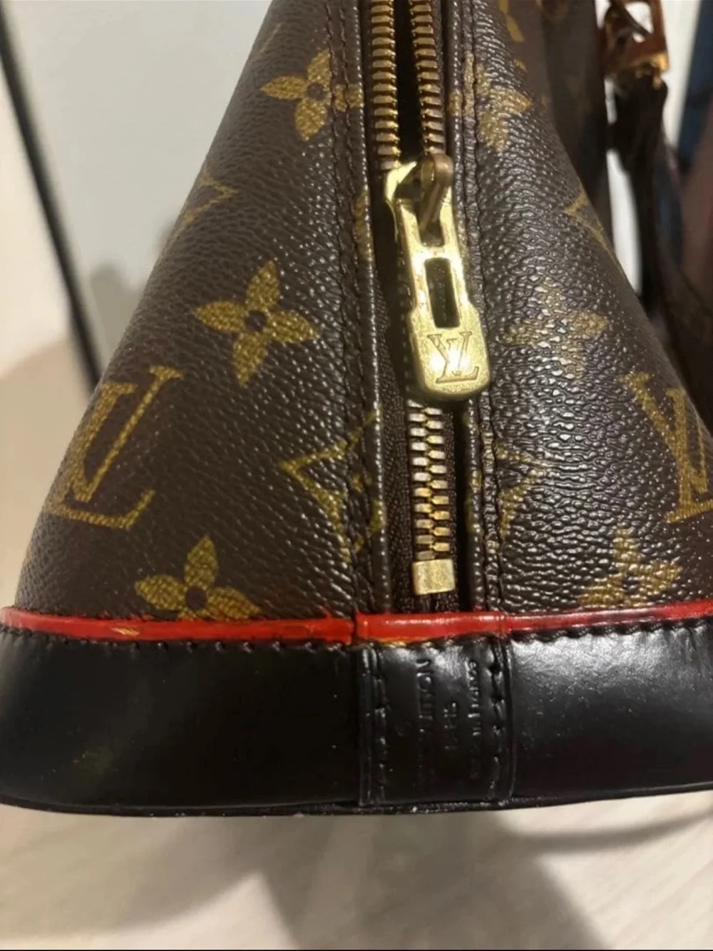 Louis Vuitton Monogram Alma Satchel in Brown with Red Trim